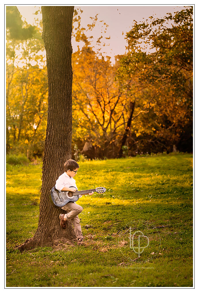 Portrait Photographer Kenmore, Boy playing guitar